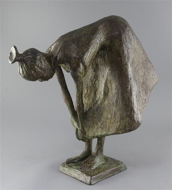 20th century Continental School. A bronze figure of a woman bending over, height 20.5in.